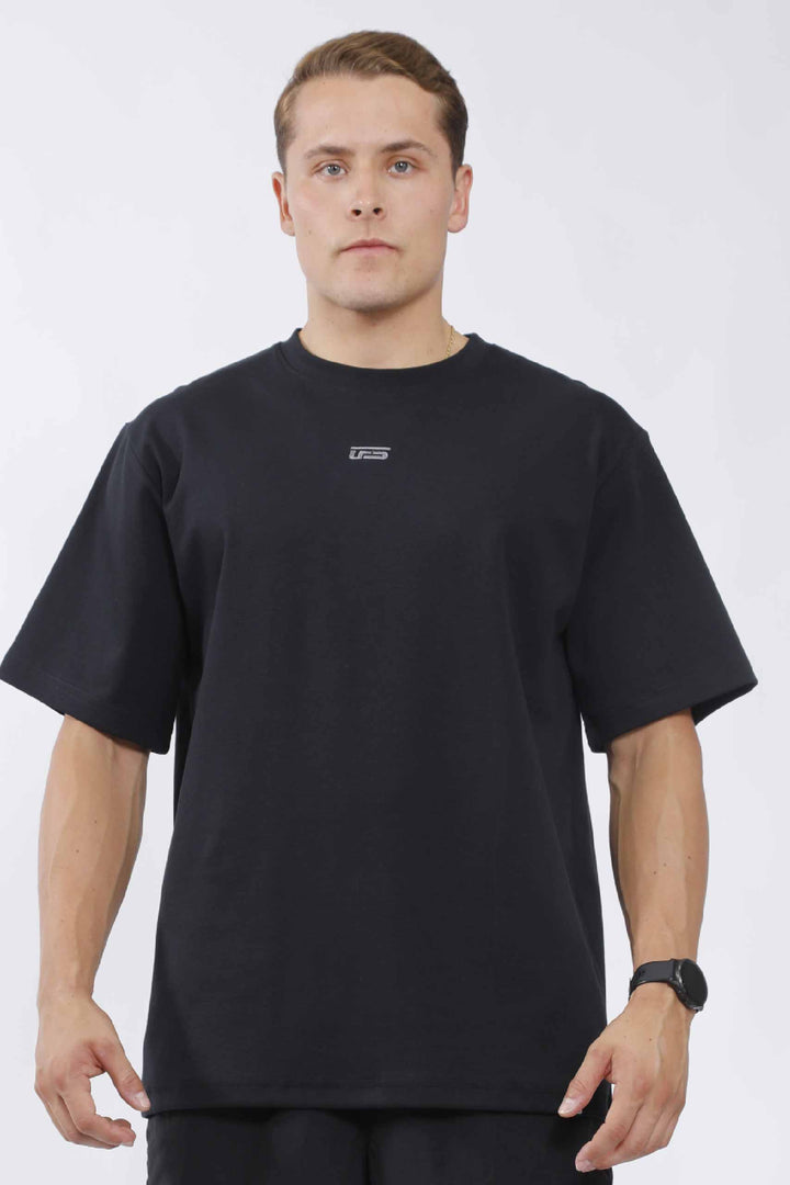 Camisa oversize hombre negra – UF Sport (foto 1 de 3)
